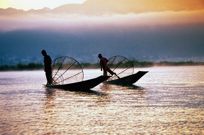 Silhouette of two fishermen on Inle Lake, Myanmar