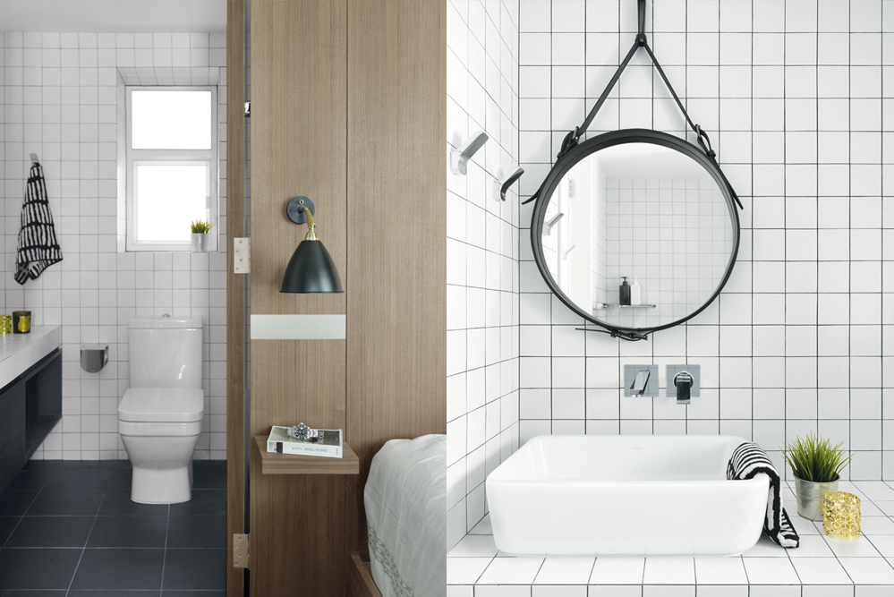 The monochromatic bathroom, clad in white ceramic tiles and black grouting, is a study in clean lines; the hanging mirror is from Gubi.