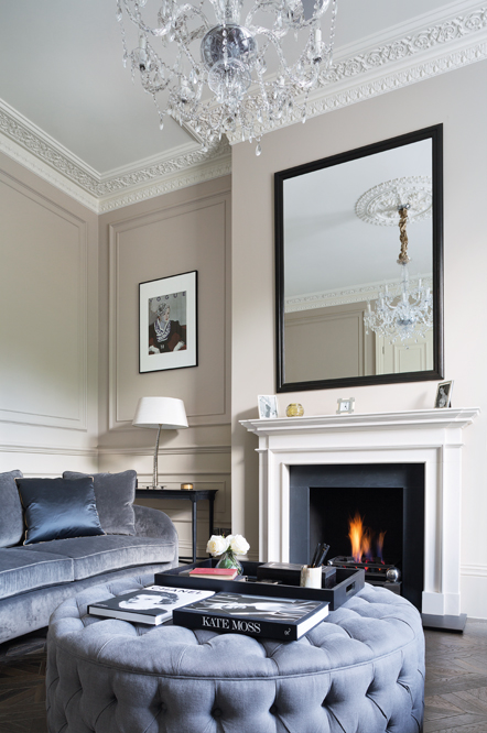 Seating is grouped around a statement fixture – the fireplace.