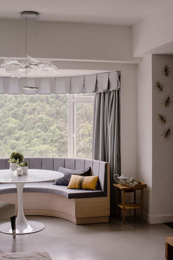 Overlooking lush foliage, the contemporary dining area is the family’s favourite hangout space.