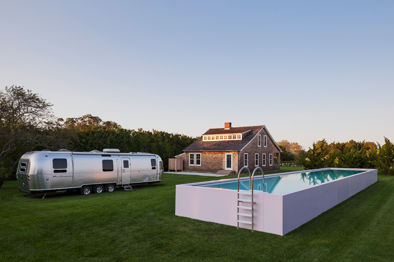 A residential project in Sagaponack, New York, features a pink pool that serves a dual purpose as an art installation and fully functional lap pool