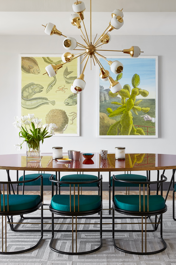 Art by Pierre de Tan hang in the dining area, complemented by Sputnik chandeliers by Fedele Papagni and a floor lamp by Michael Anastasiades for Nilufar