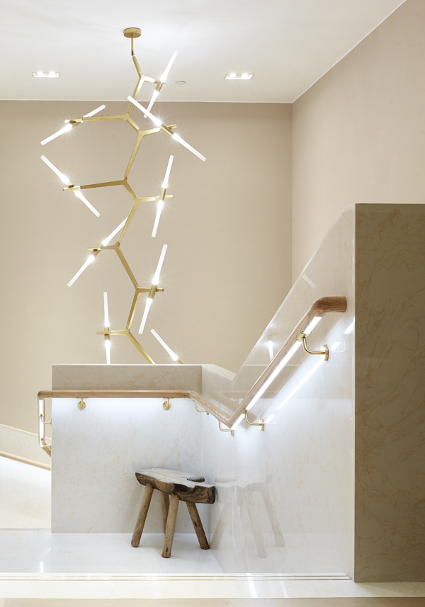 Statement lighting and gold accents add elegance into the space