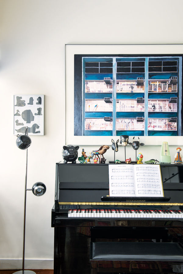 Playful animal-themed pieces sit above the piano