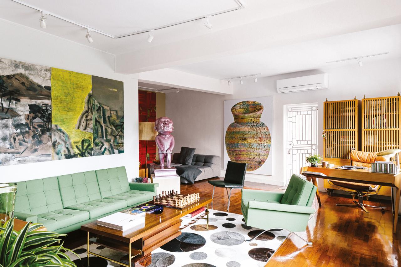 Scandinavian and midcentury modern furniture pieces highlight the home’s spaces alongside works from the likes of post-war Chinese artist Hsiao Chin