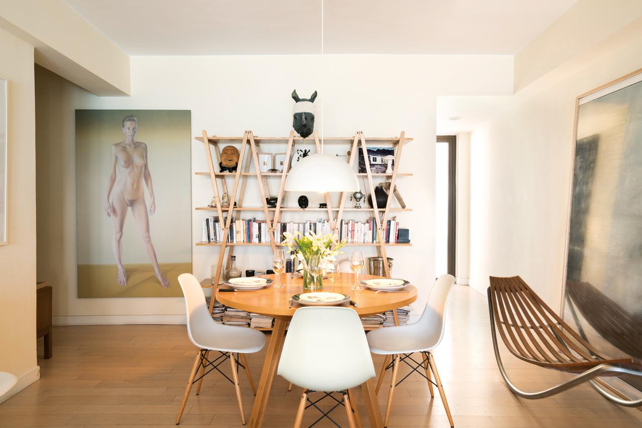 The dining room, adorned with more art and interesting furniture