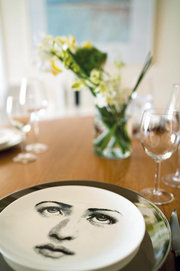 Dishes are by Fornasetti, available at Lane Crawford