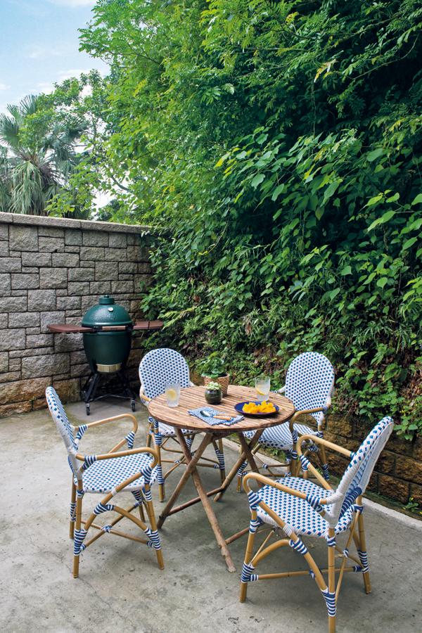 Outdoors, a bistro-inspired dining set creates a casual vibe 