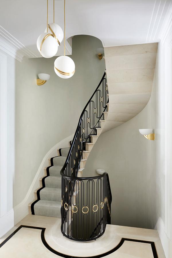 A cantilevered stone staircase is the unequivocal centrepiece of the lair, connecting all five storeys while serving as a compelling visual anchor.