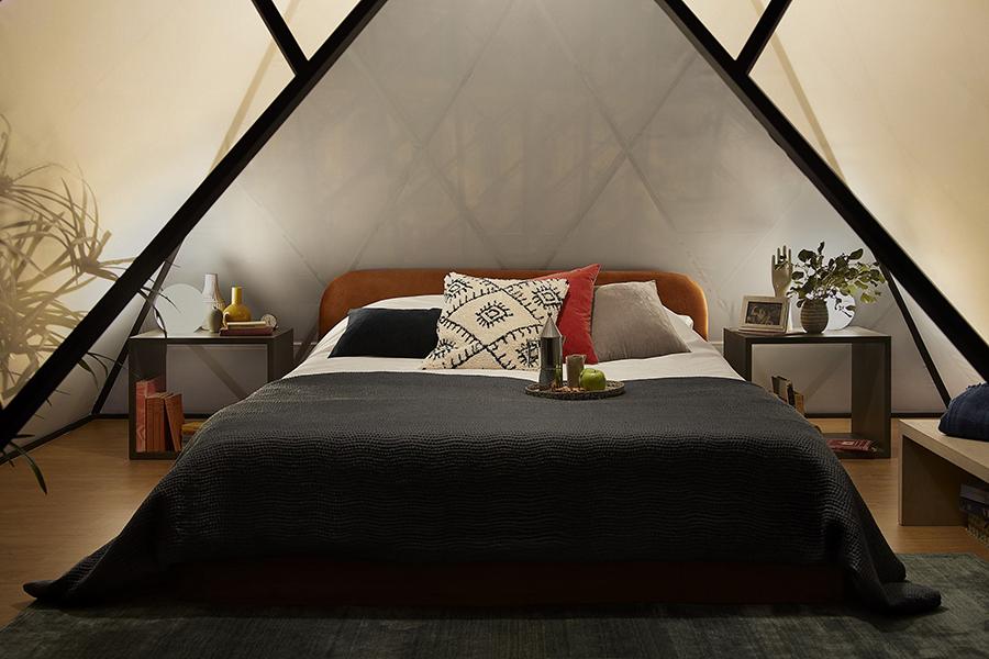 The cosy bedroom setup within the mini pyramid. (Photo: Julian Abrams, courtesy of AirBnb)