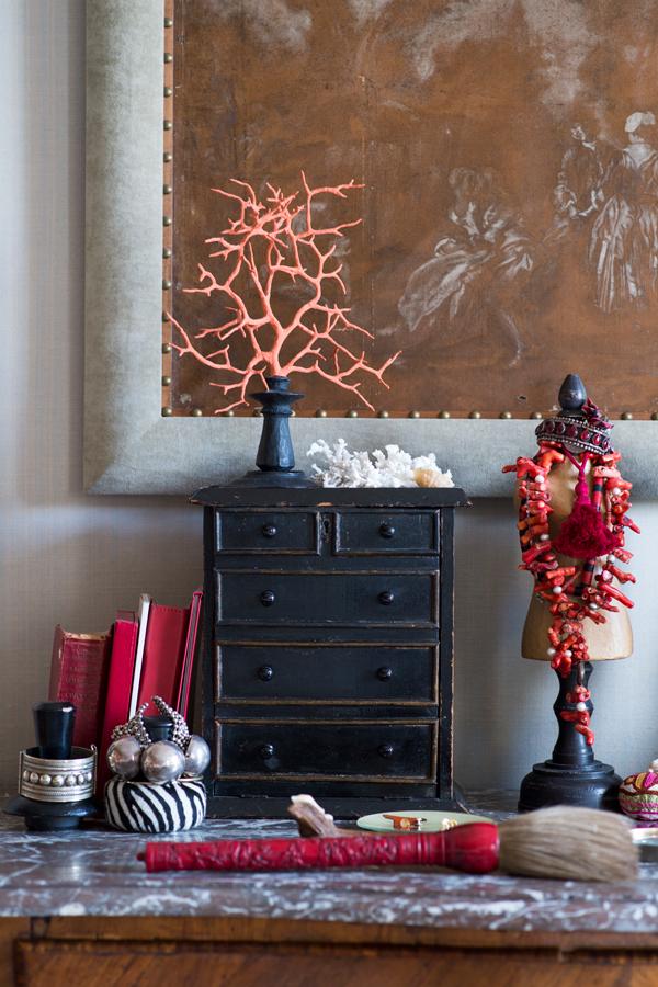 The bedroom is relatively more subdued, with pops of colour injected through decor