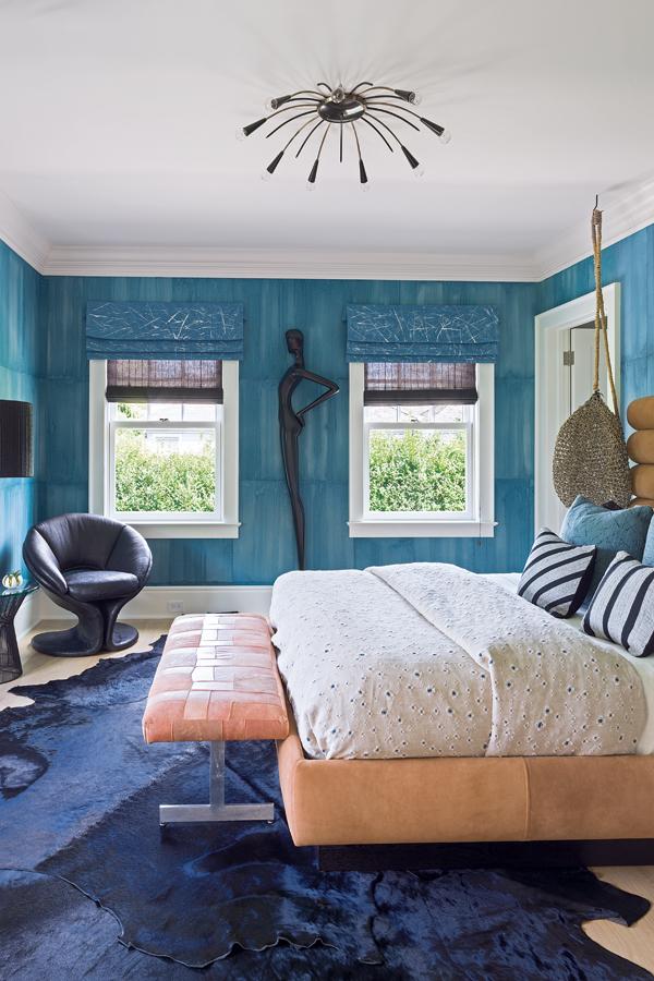 The Denim guestroom is named after its predominantly blue palette, seen in the Cannon/Bullock wallpaper and the indigo Kyle Bunting hide rugs.