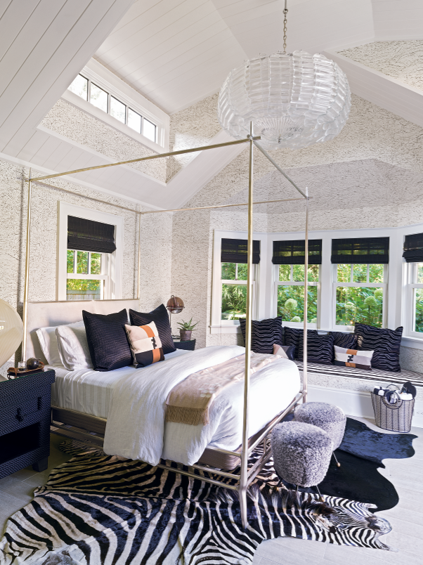 The guest pavilion's Penthouse bedroom is swathed in luxurious fabrics; the bed is from Ironies. 