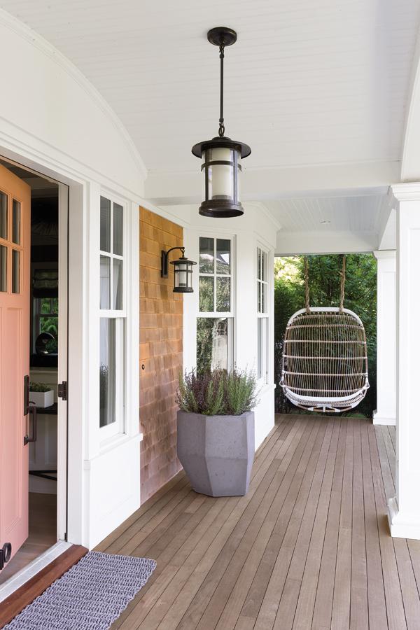 A salmon pink door greets guests