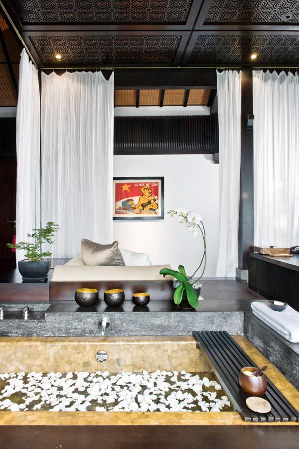 A tub made of traditional Vietnamese duck egg lacquer sits in the master bedroom, positioned steps from the expansive his and hers bathroom that walks out to an open shower