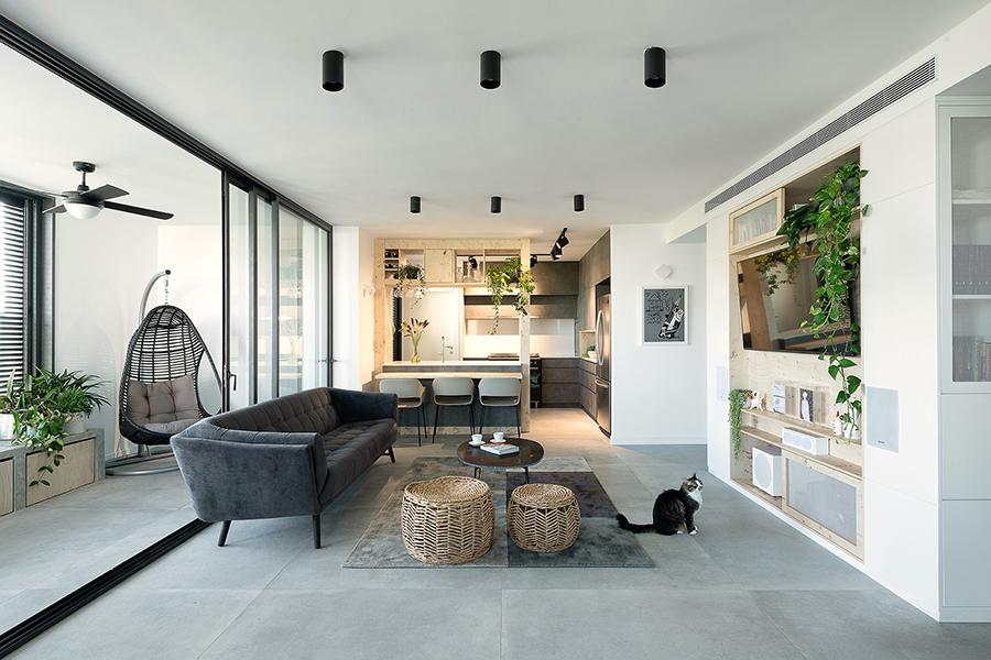Studio Perri created an elegant modern abode for a small family with children and pet cats, featuring clean lines, homey and durable furniture, and a warm colour palette