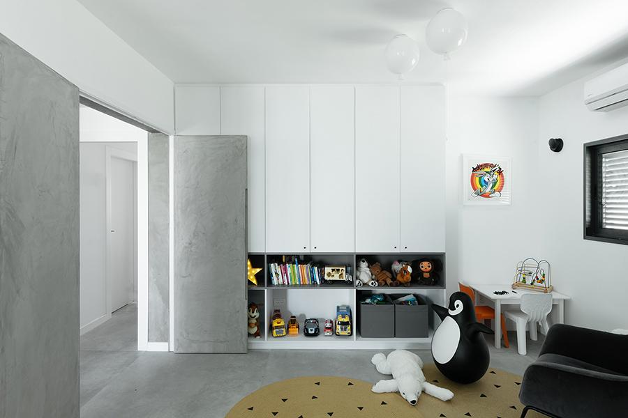 The play room features two large doors and curtains that can be opened to become part of the living area, or closed off for privacy, or to become a new room