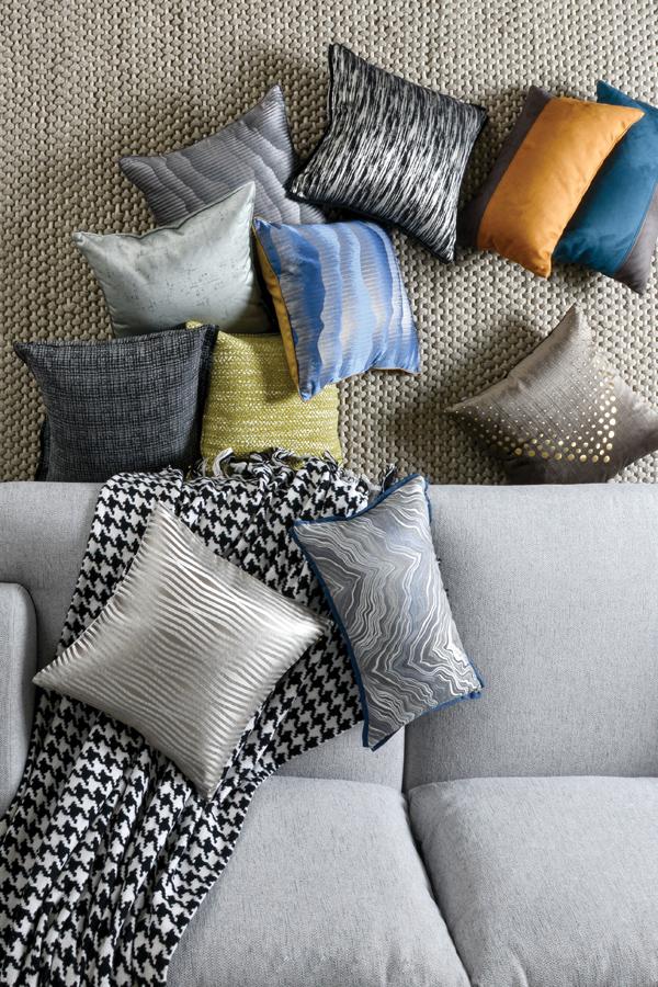 Rather than sticking with a single-hued scheme, go bold by mixing contrasting colours and patterns