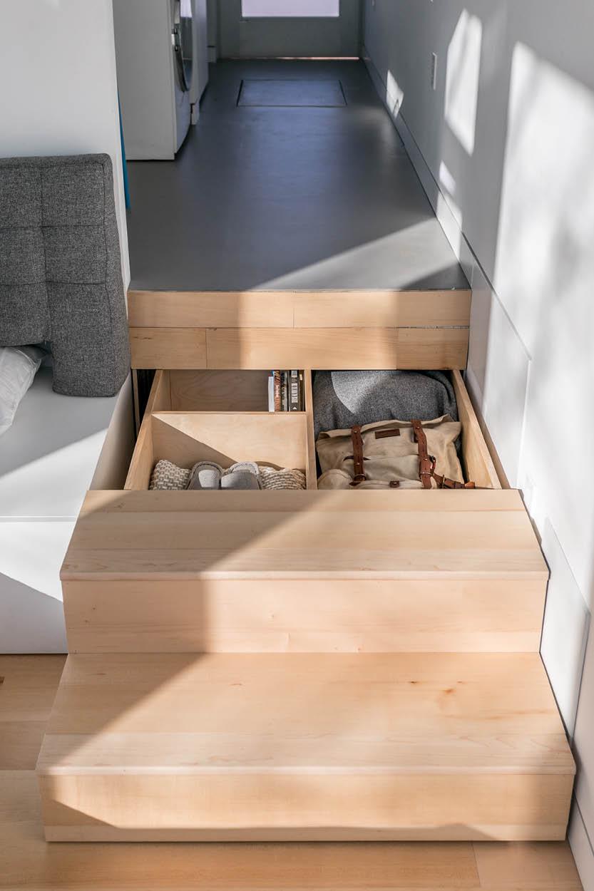 The stairs next to the sofa bed are in fact a generous-sized drawer to store all personal belongings