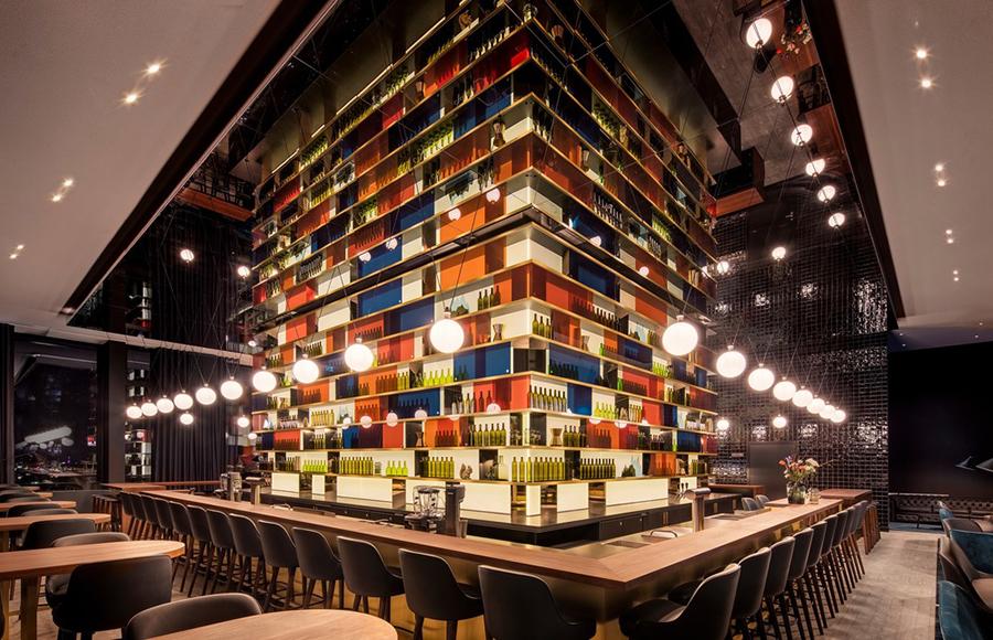 The hotel's M'Uniqo Bar with its showstopping bottle display case. (Photo: Courtesy of concrete)