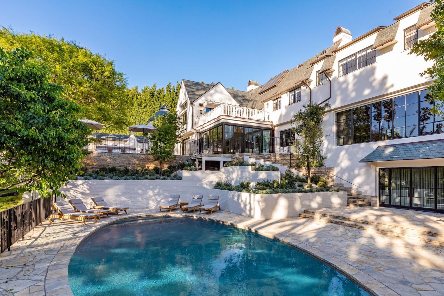 The home boasts superior privacy, located behind gates within a secluded stretch of Beverly Hills