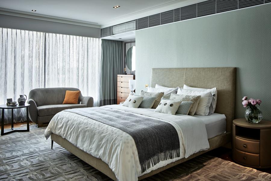 More subdued and contemporary, the master suite conveys warmth and relaxation