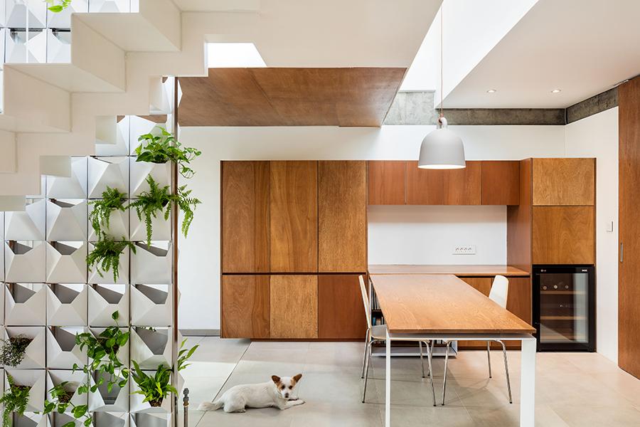 A wine fridge built into the apartment features in the open-plan dining area, as do plenty of storage solutions. (Photo: Kyungsub Shin)