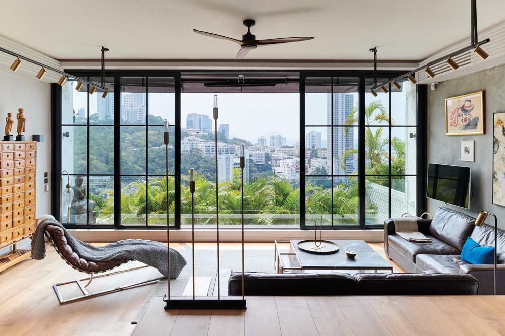 Floor to ceiling windows looks out to sweeping cityscape