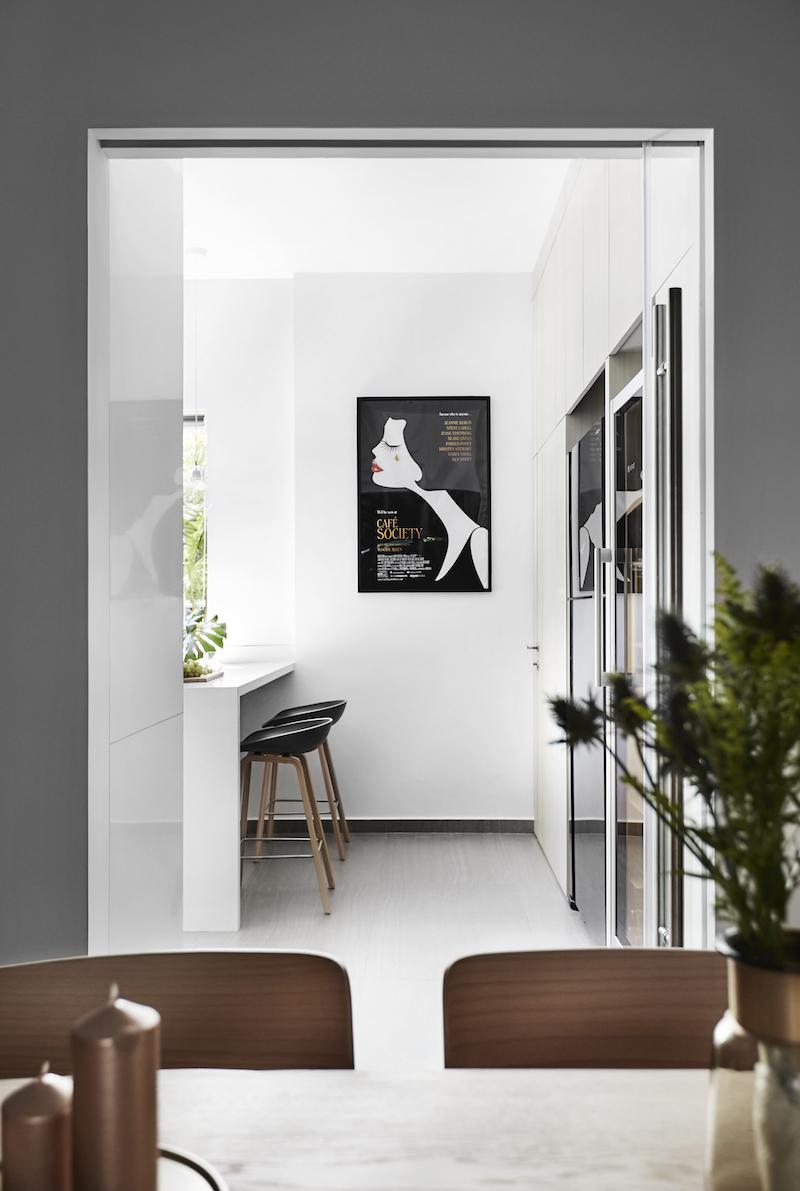 Viewing the corridor into the kitchen from the living and dining area