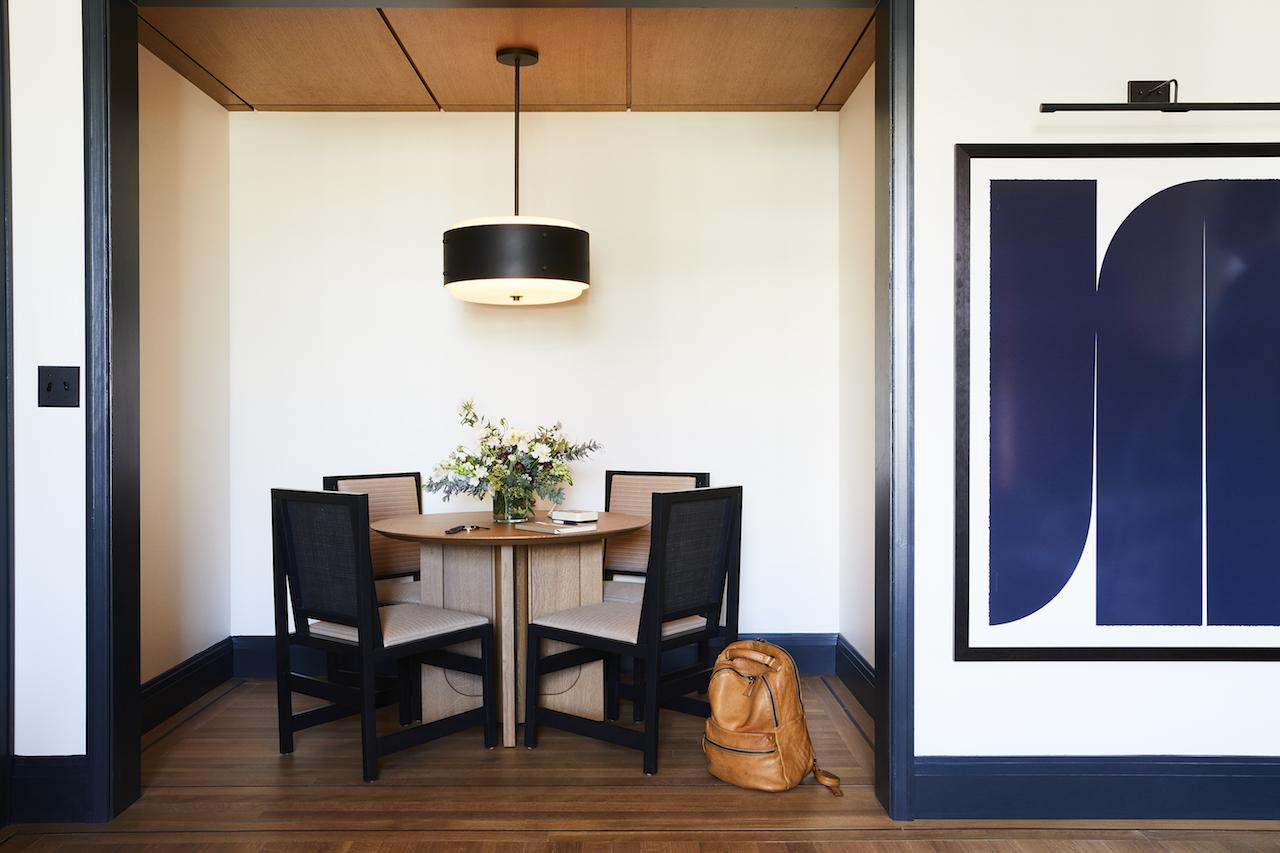 Touches of a signature hue called Shinola Blue against cream walls in one of the rooms