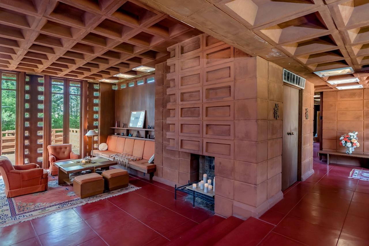 The furniture, also designed by Frank Lloyd Wright, is also included in the sale.