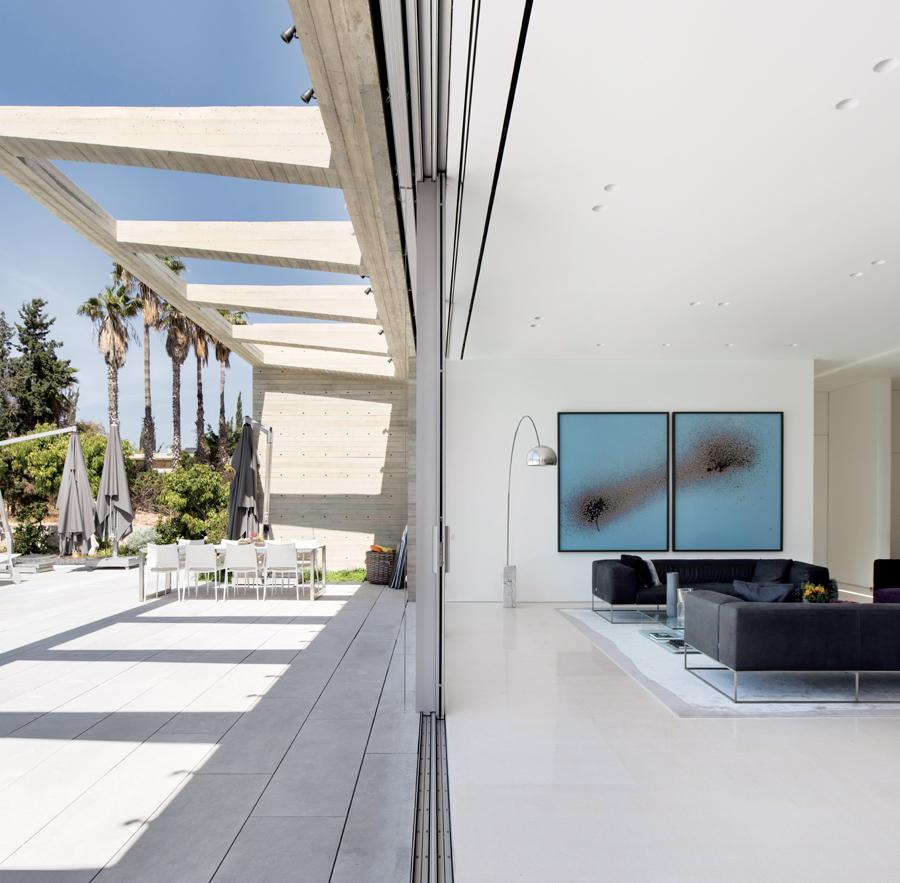 The home features a 65ft-long pool and sprawling al fresco areas