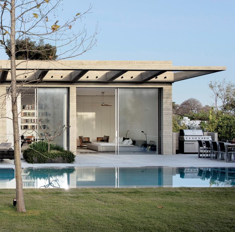 Large deciduous trees are positioned to the west of the house in order to cast shade