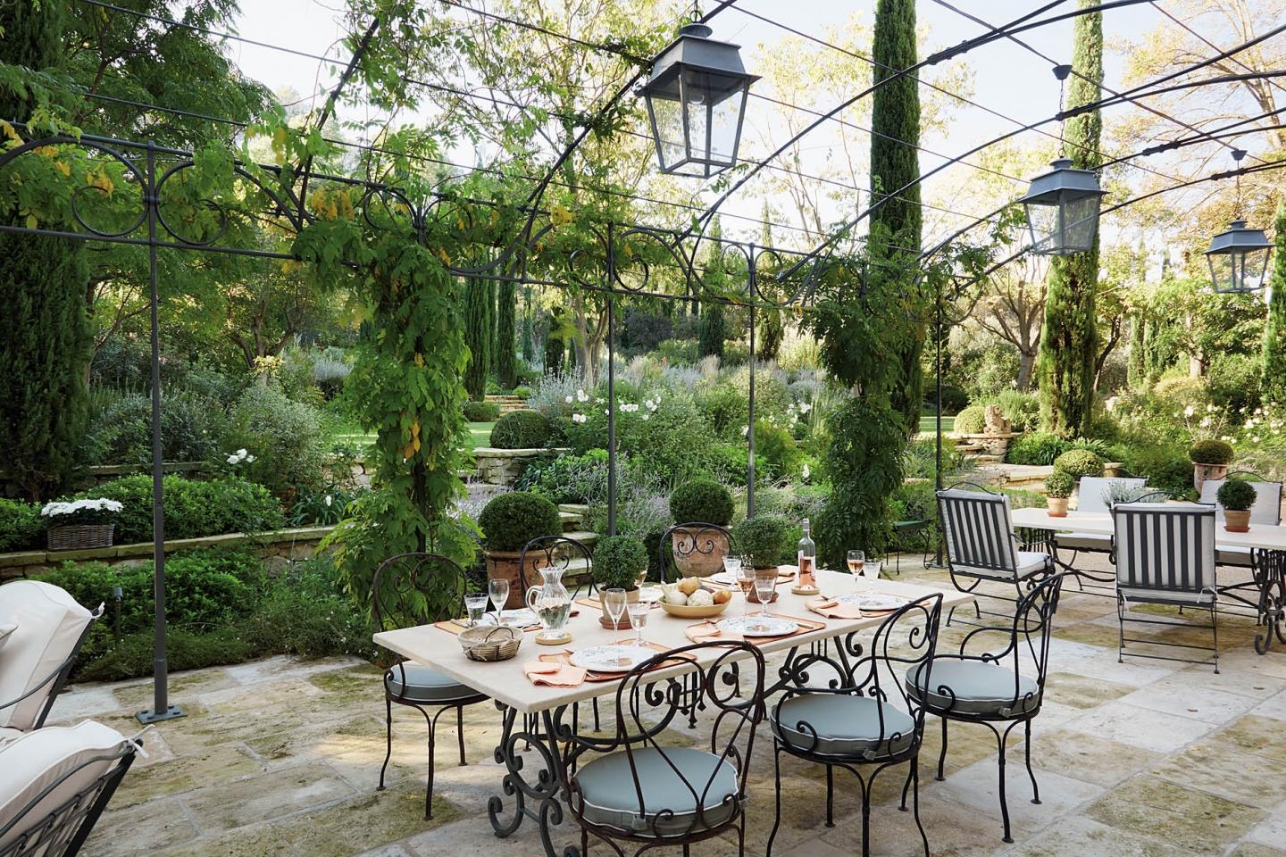 A terrace in Provence. “Due to historic preservation laws, all our changes (to the farmhouse) had to take place within the existing walls and footprint. We wanted to respect the past but bring the house into the present with a coherent floor plan that reunified the interior into a warm, welcoming home for family and many guests. (Photography by Fritz von der Schulenburg)