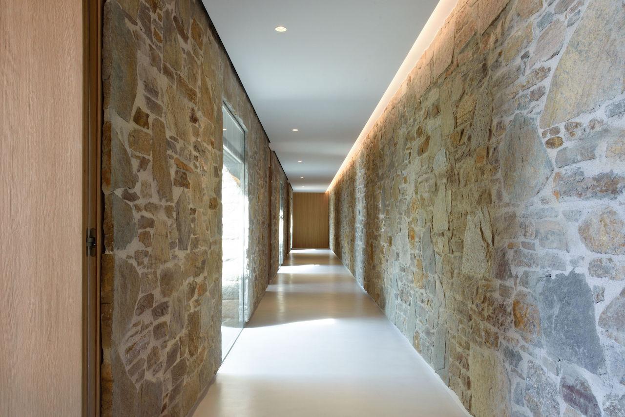 A neutral colour palette complements the use of wood and stone throughout the villa
