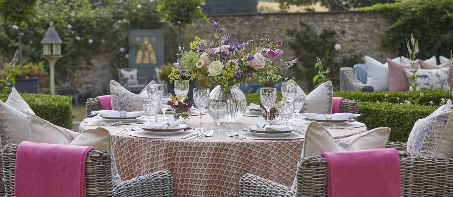A table setting arranged by the designer in the garden