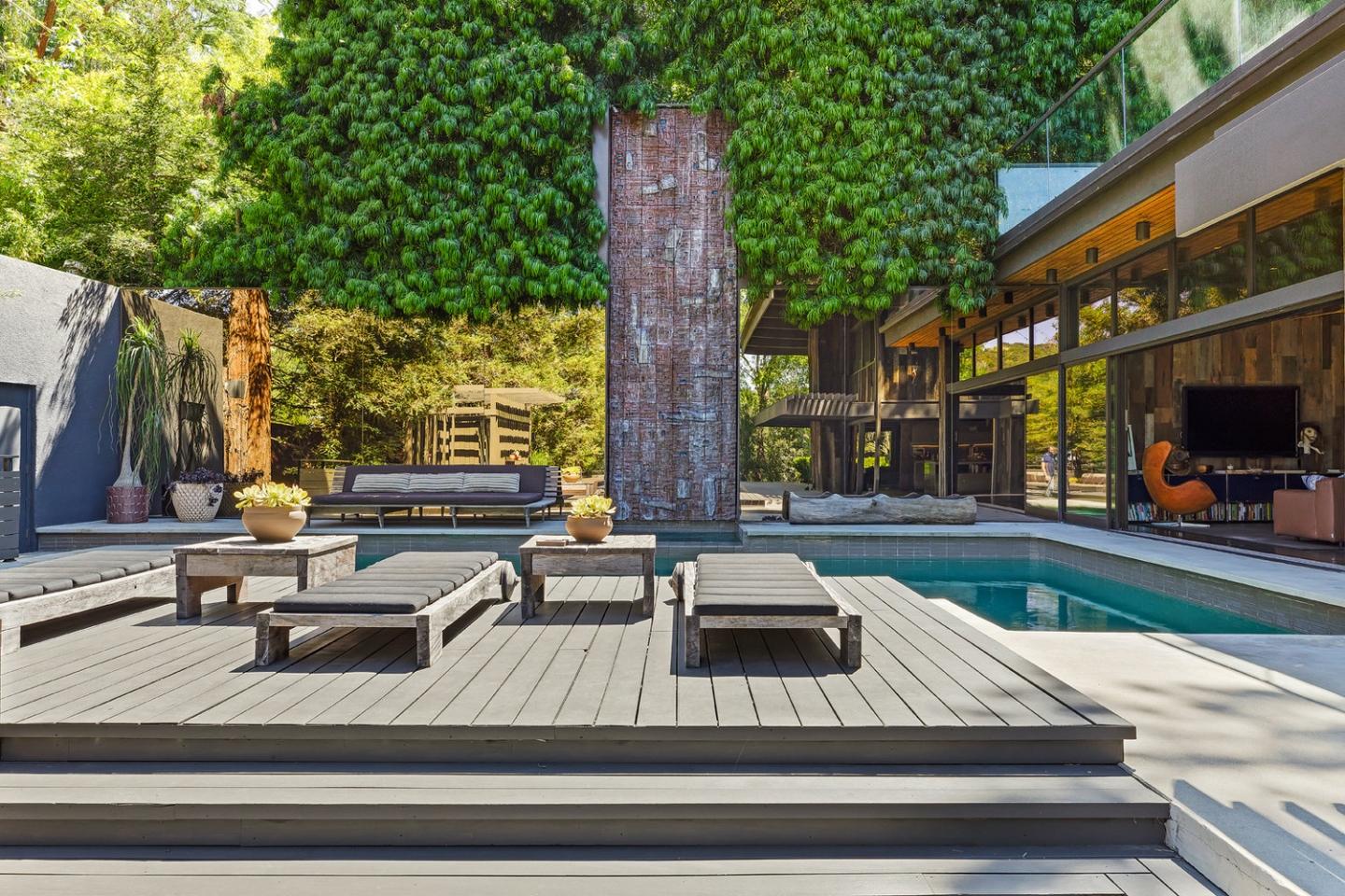 A separate pool house and an expansive poolside patio offer plenty of entertaining spaces 