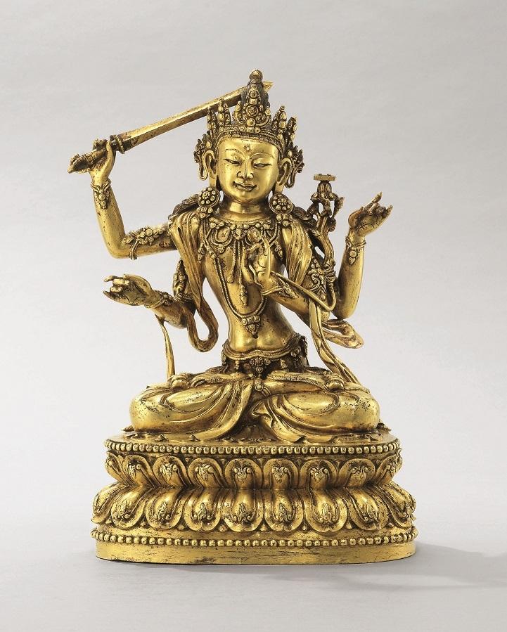 A very rare imperial early Ming large gilt-bronze figure of Caturbhuja Manjusri Xuande incised six-character presentation mark and of the period (1426-1435). 10 in. (25.5 cm.) high. HK$5,500,000-8,000,000