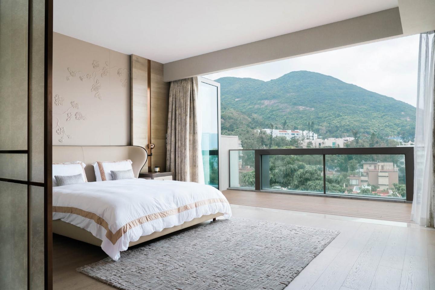 The tranquil master bedroom is the professional's sacred retreat to unwind and recharge. Soft furnishings and wallcoverings from Coltex imbue warmth throughout the space