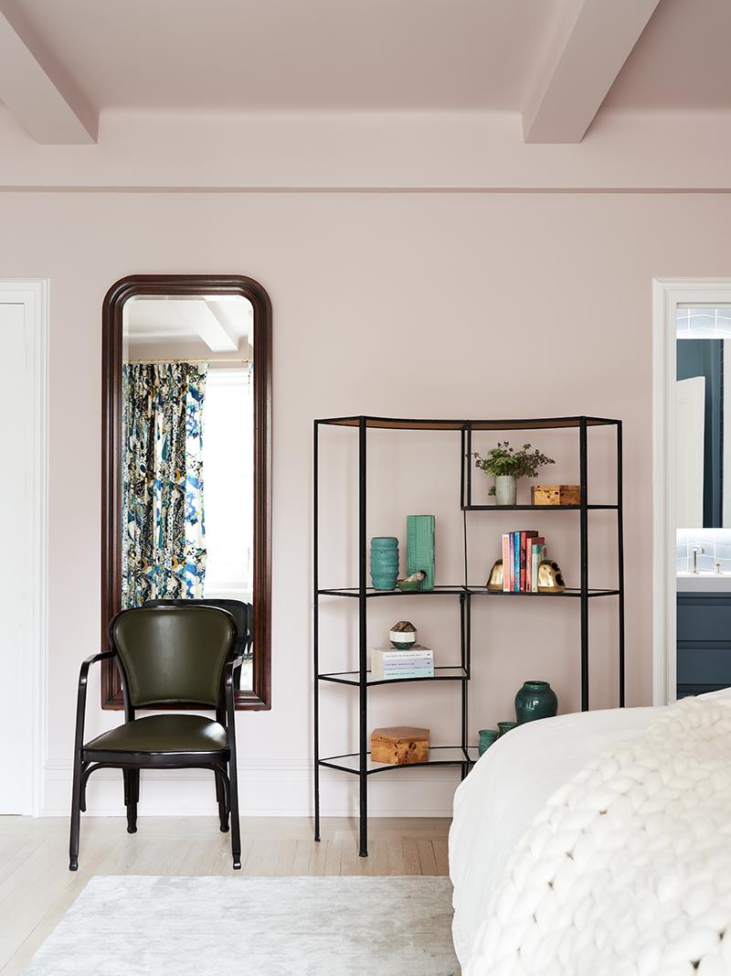 A vintage shelving unit by Frederick Weinberg, sourced from eBay, display ceramics and books collected by the couple. (Photo: Brooke Holm)