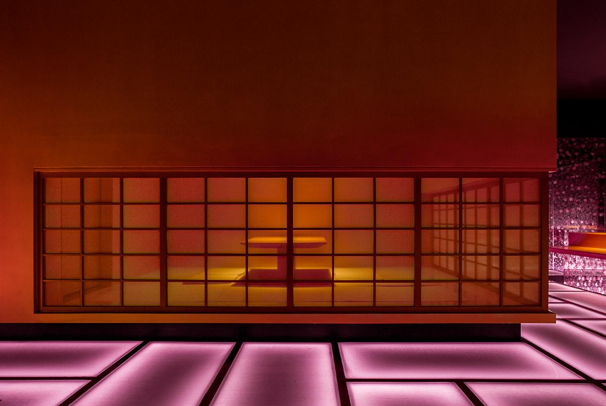 A closeup of the private dining room, in a contrasting amber glow. (Photo: Courtesy of Shanghai Hip-pop Design)