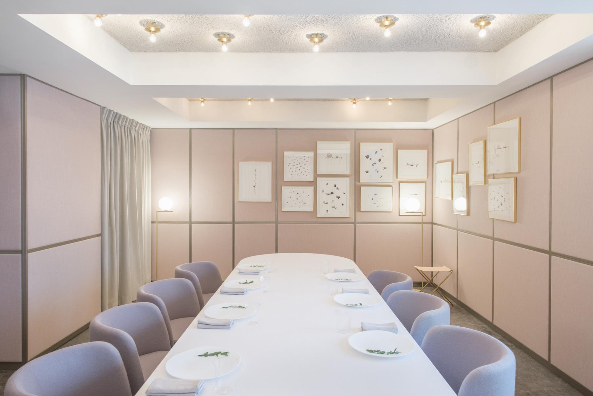 A private dining room adorned with artworks by Dawn Ng