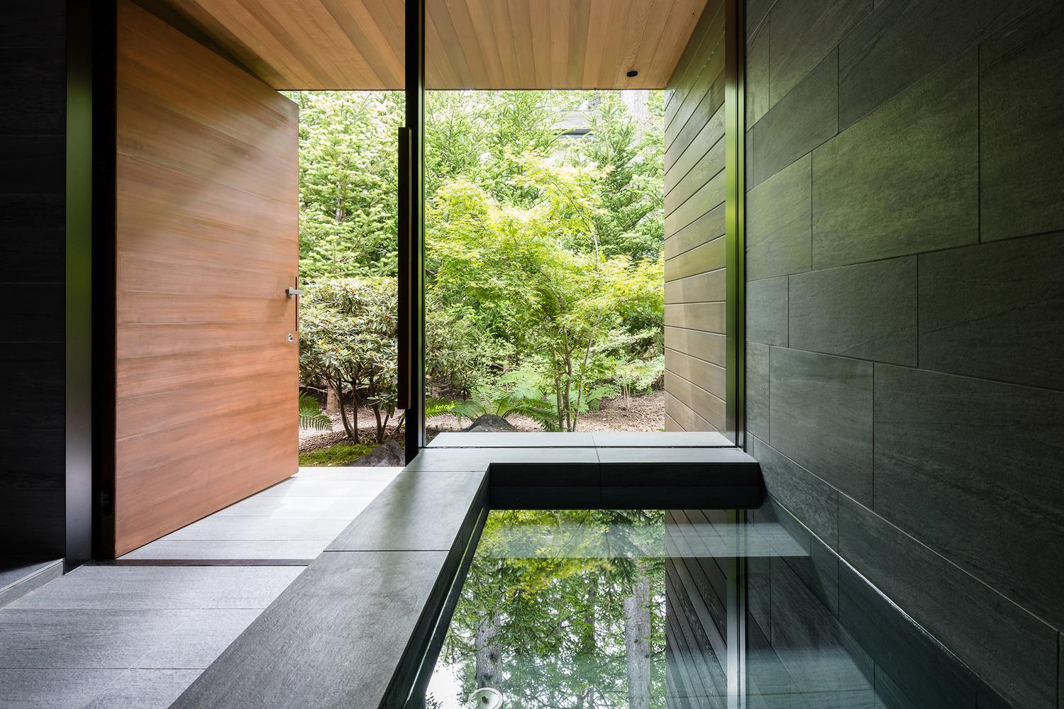 A Curvaceously-Roofed Villa in Karuizawa Melds Into The Landscape