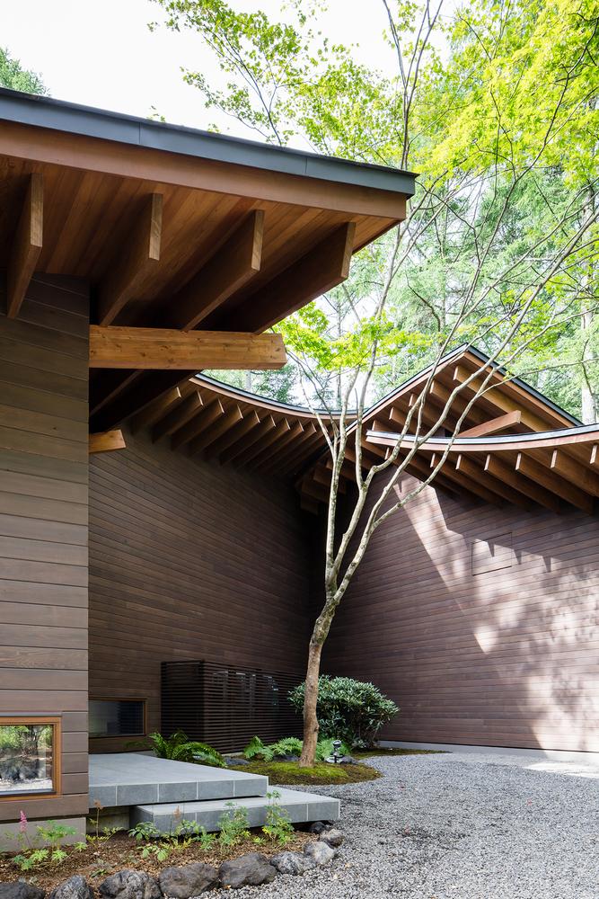 A Curvaceously-Roofed Villa in Karuizawa Melds Into The Landscape