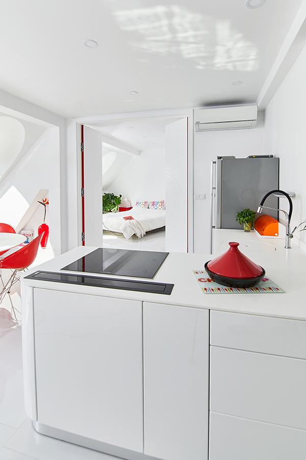 This All-White, 1,180sqft Apartment in Budapest is Splashed with Pops of Primary Colours