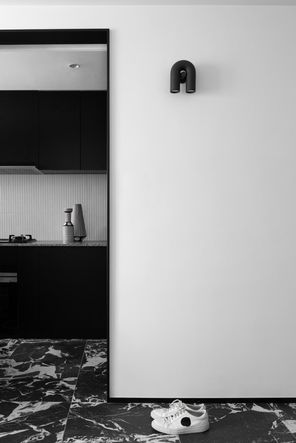 Inside a Bauhaus-inspired black and white bachelor's pad in Hong Kong