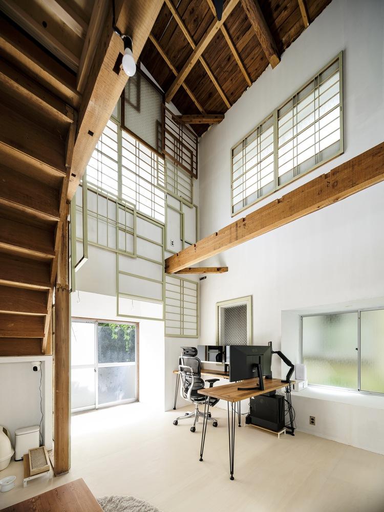 This two-storey house in Japan is decorated with old door frames 