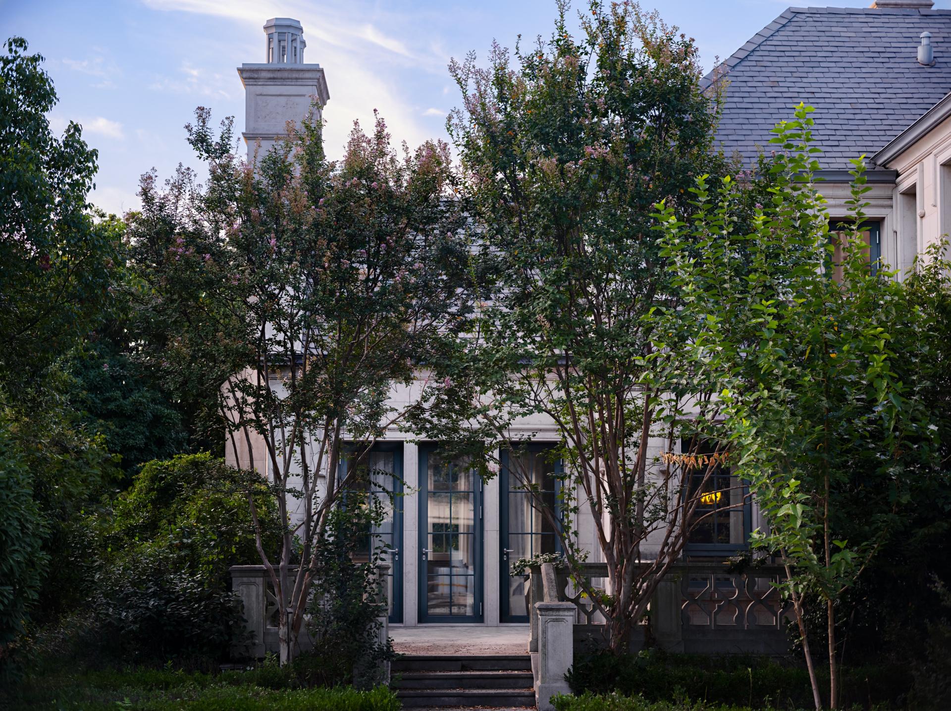 UD Studio creates a warm, minimalist home in this French-style villa in Shanghai