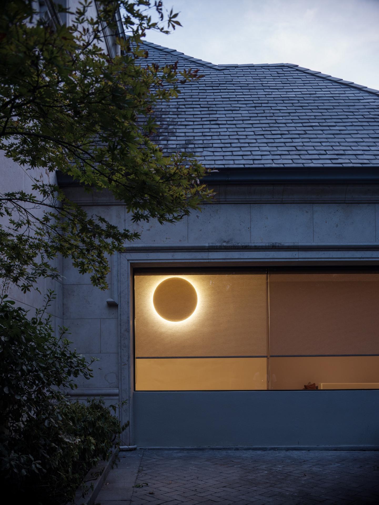 UD Studio creates a warm, minimalist home in this French-style villa in Shanghai